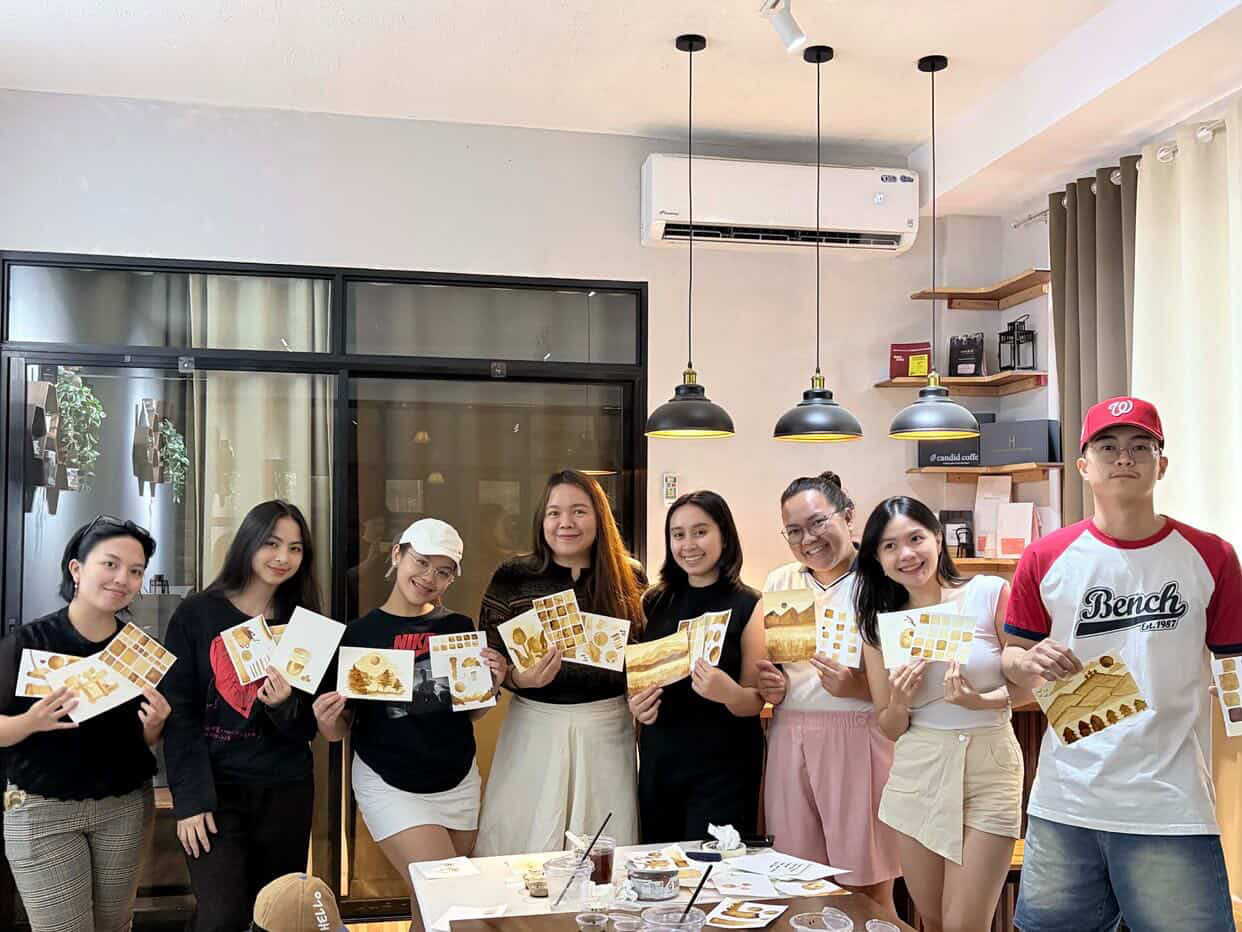 Guests showing their matcha art from a Kaizen Spaces workshop